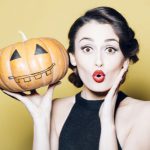woman holding a pumpkin